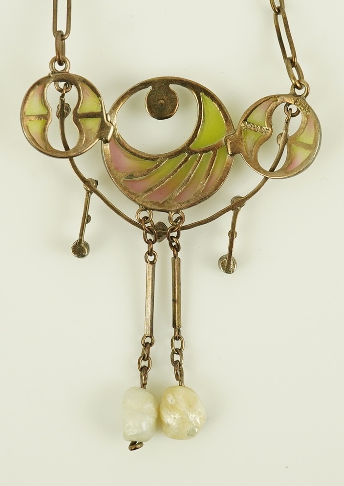 An early 20th century French silver gilt, baroque and seed pearl set plique a jour enamel pendant necklace